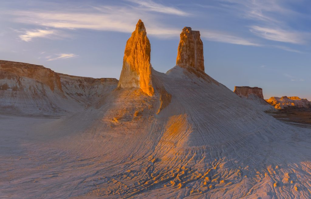 Fangs rock formations illuminated by sunset, Mangystau, Kazakhstan