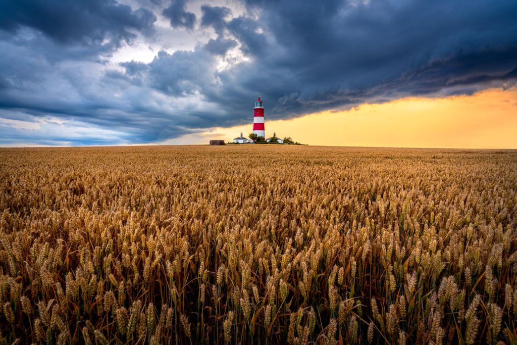 Happisburgh lighthouse against stormy skies in Norfolk, England