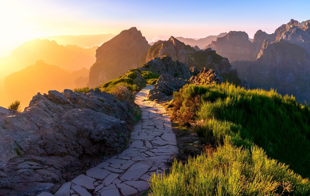 Sunset over rocky path and mountains at Pico do Areeiro, Azores, Portugal
