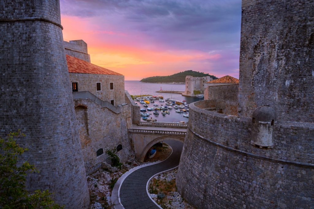 Revelin Bridge at sunrise with boats in the harbour, Dubrovnik, Croatia