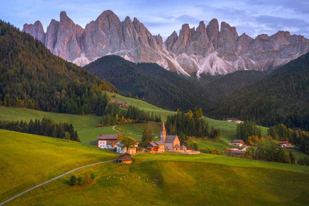 Scenic view of Santa Magdalena village with mountains in Dolomites, Italy