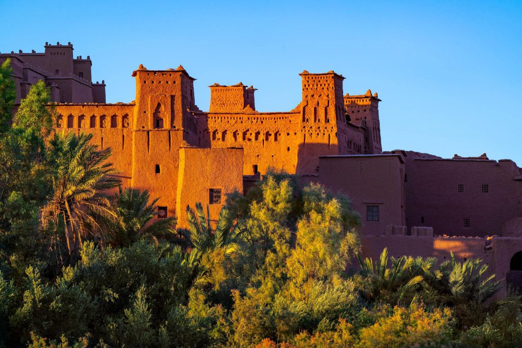 Aït Benhaddou kasbah glowing in sunset light, Morocco