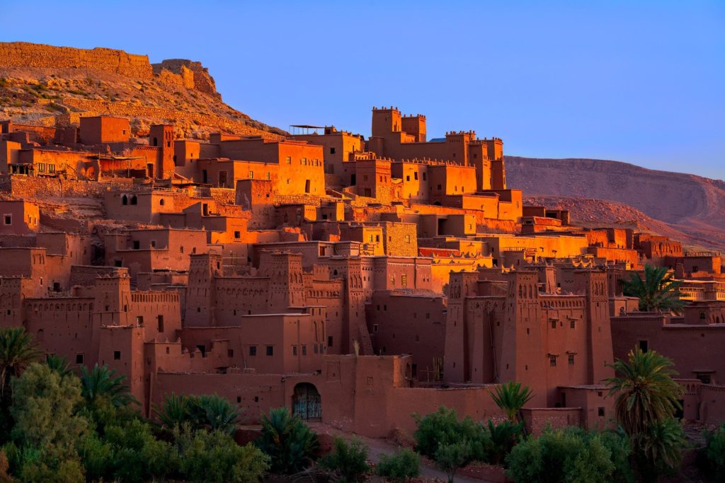 Morning light illuminating the earthen buildings of Aït Benhaddou, Morocco