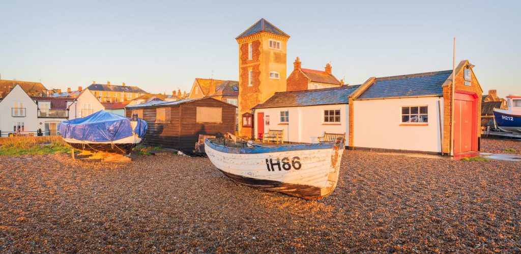 Aldeburgh Lifeboat House on the beach in the golden sunrise light