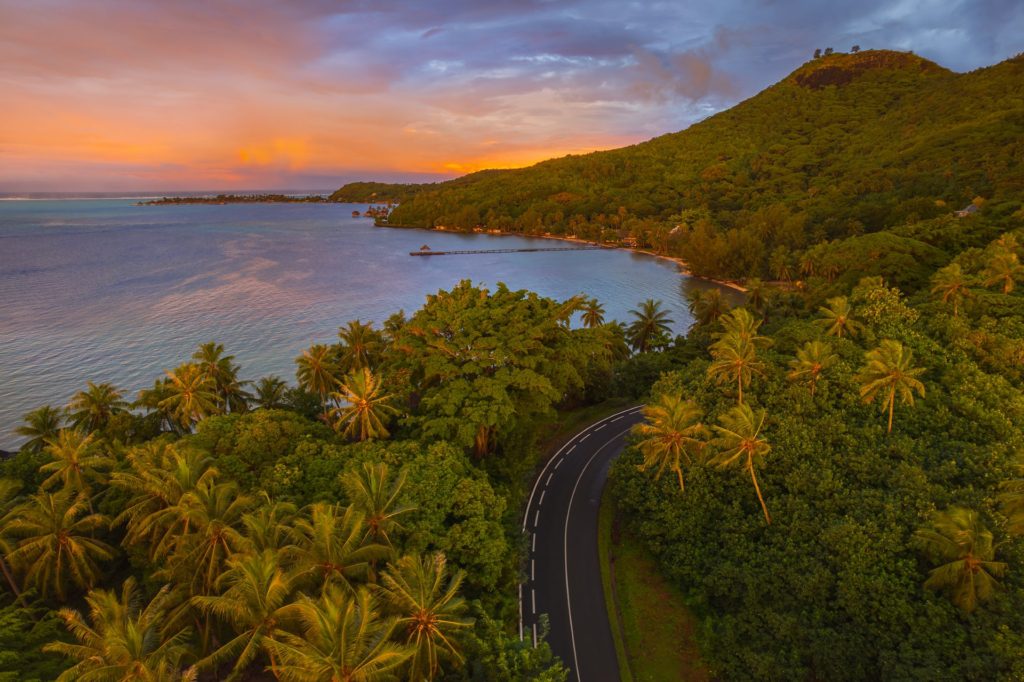 Sunrise over a winding road on Bora Bora, French Polynesia