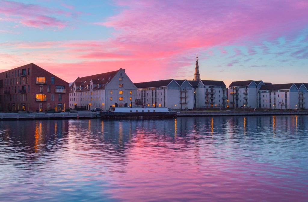Colourful sunrise over Christianshavn, Copenhagen reflecting on the water