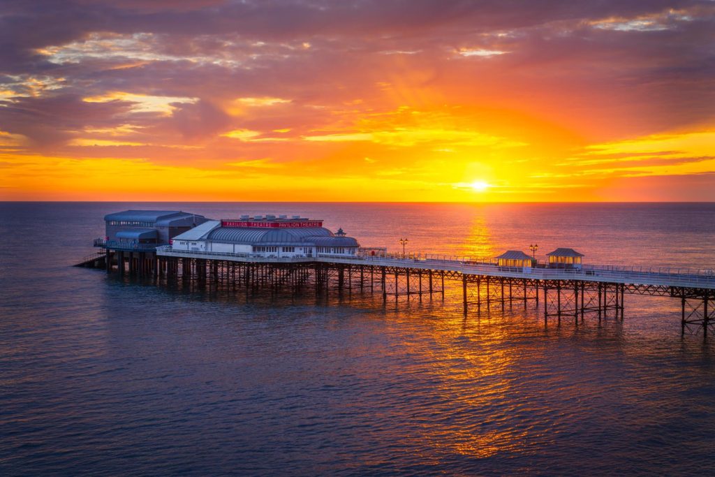 Cromer Pier at sunrise over the North Sea, Norfolk, England