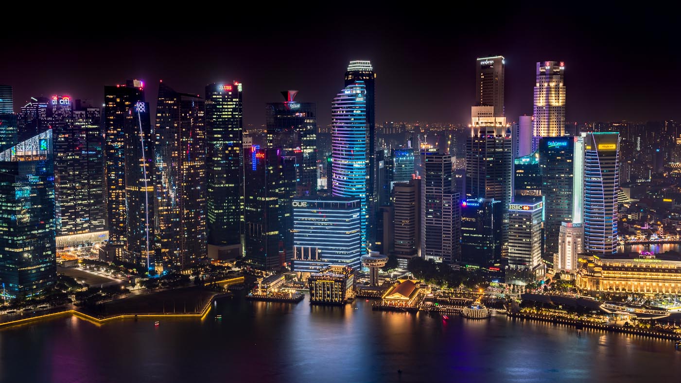 Downtown Singapore night time view from the Marina Bay Hotel
