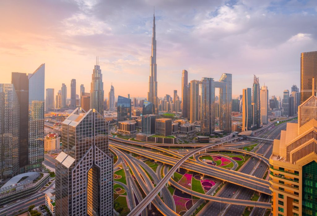 Downtown Dubai skyline at sunrise with Burj Khalifa and roads