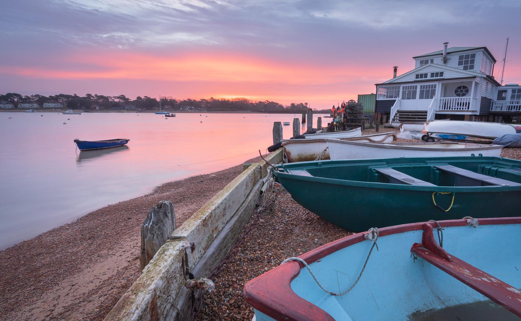 Felixstowe Ferry boatyard with a colourful winter sunrise