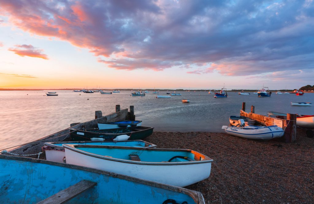 Ferry boats at sunset on the River Orwell, Felixstowe, Suffolk, England