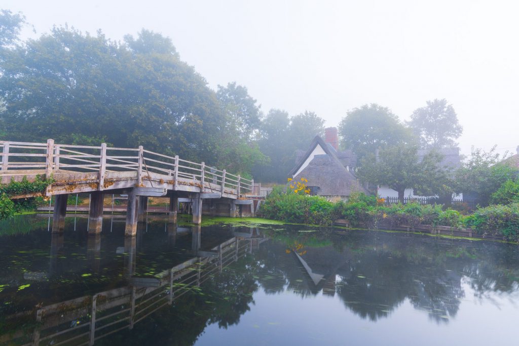 Flatford Mill in Dedham shrouded in morning fog, England