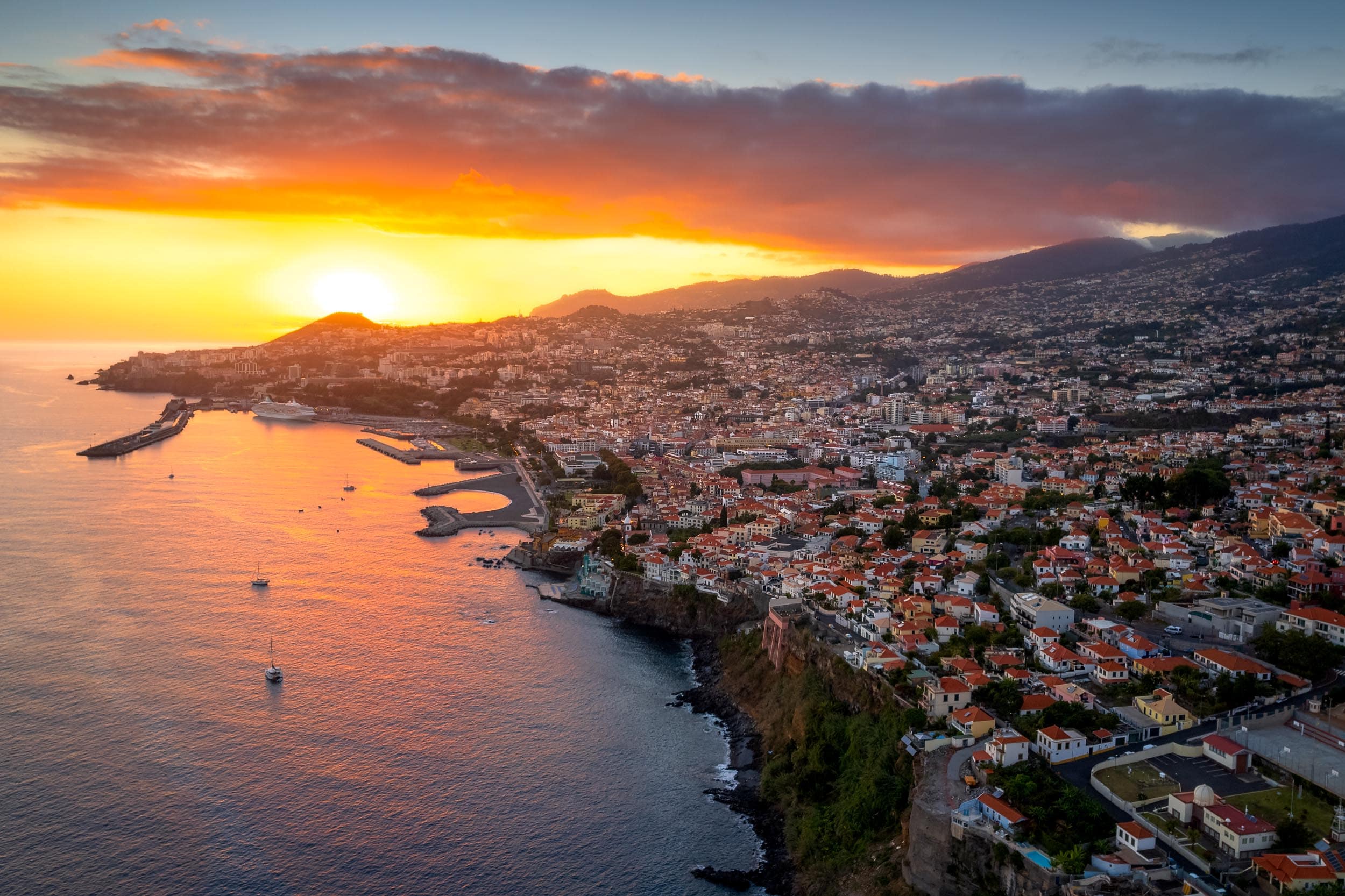 Sunset over Funchal, Madeira with vibrant sky and coastline