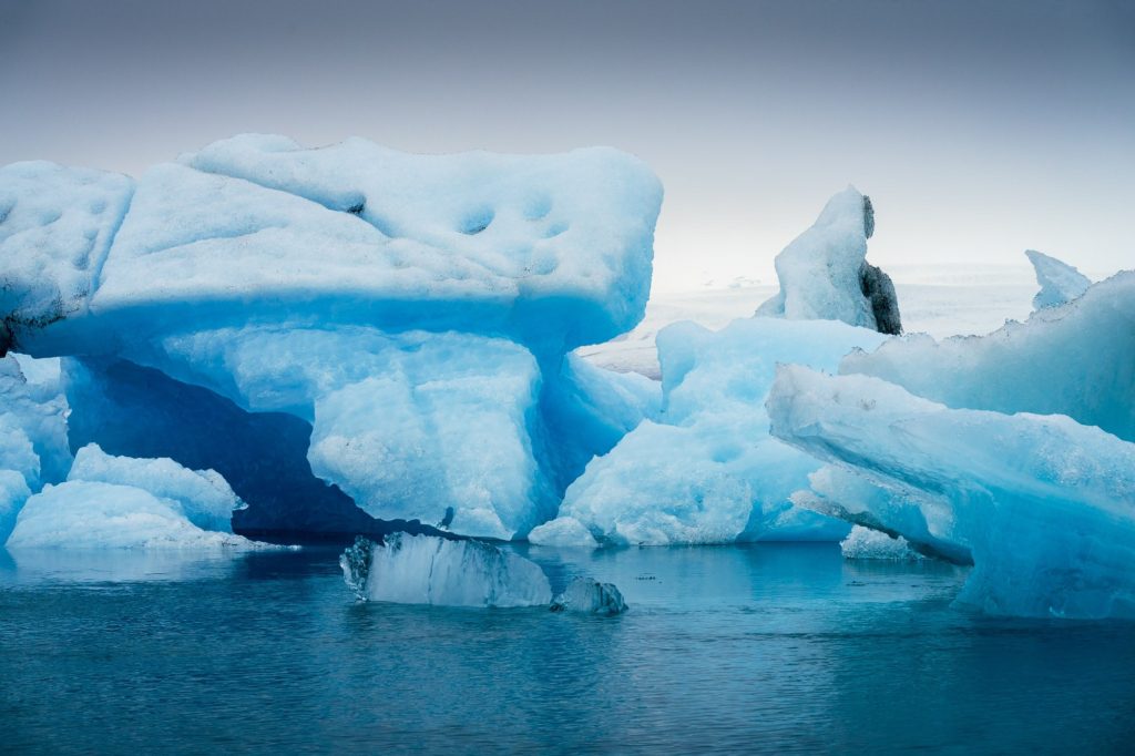 Blue icebergs floating in a glacier lake, Iceland