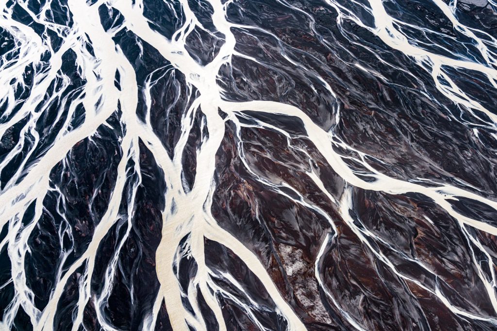 Aerial view of glacier rivers winding through Iceland's landscape
