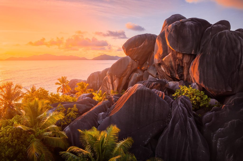 Granite rocks illuminated by sunset, La Digue, Seychelles