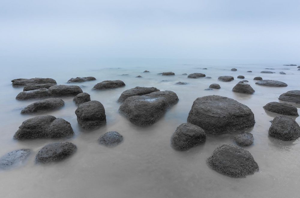 Rocks on Hunstanton beach, Norfolk, at Hunstanton revealing themselves as the tide recedes