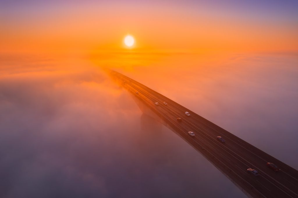 Orwell Bridge shrouded in mist at sunrise, Ipswich, Suffolk, England