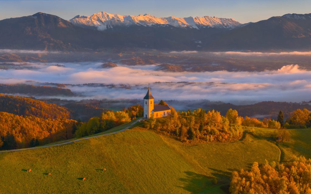 Jamnik church with mountains at sunrise, Slovenia