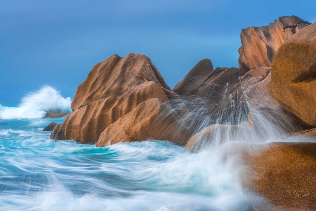 Crashing waves against granite rocks, La Digue, Seychelles