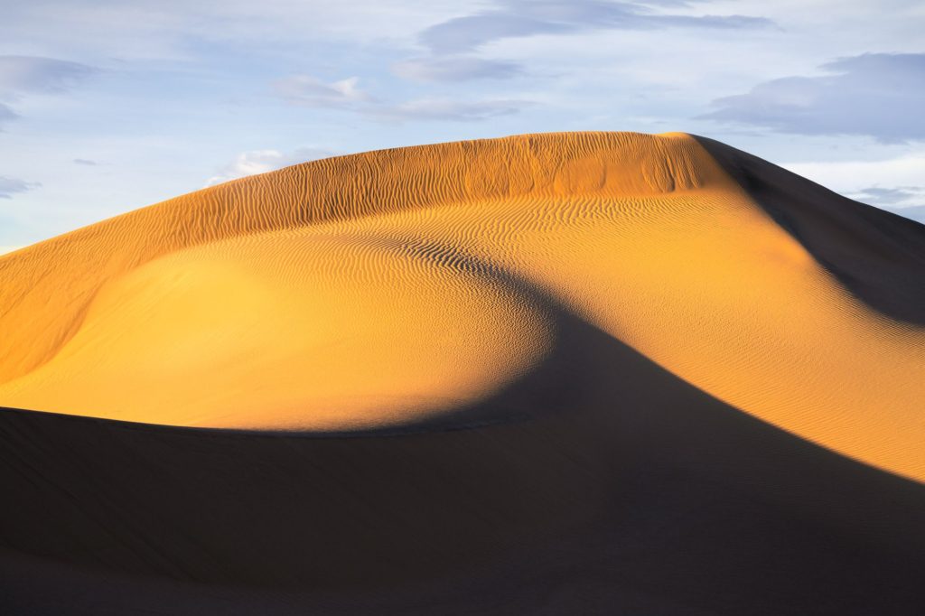 Golden sand dunes in Mesquite Flat, Death Valley, USA