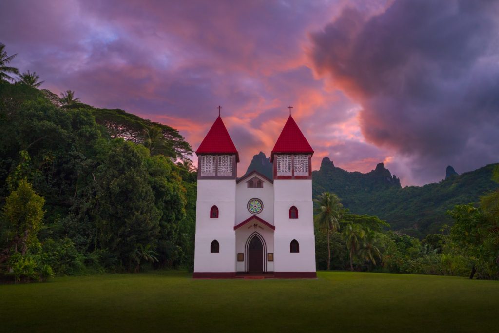 Church at sunrise surrounded by lush greenery, Moorea, French Polynesia