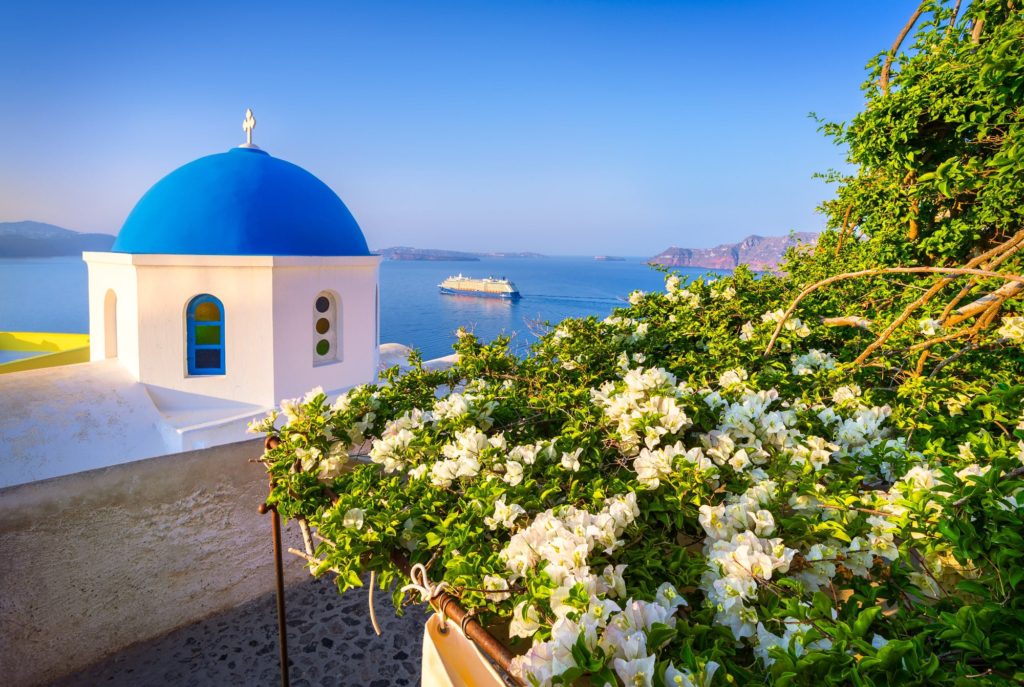 Cruise ship in the caldera at sunrise, Oia, Santorini, Greece