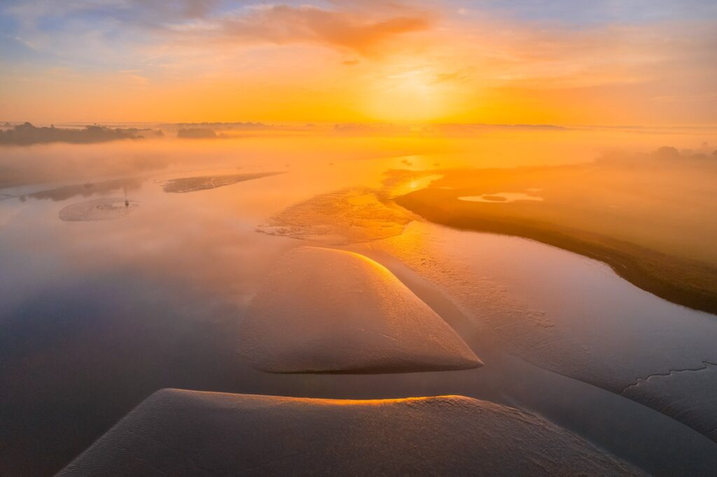 River Deben at sunrise, misty landscape in Suffolk, England