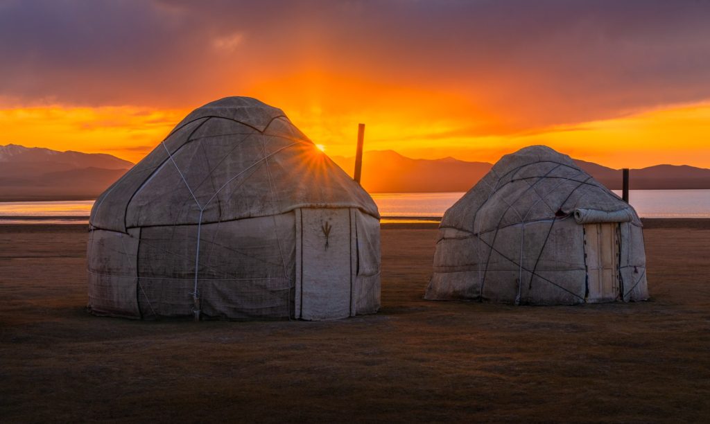 Yurts at Song Kul Lake during a vibrant sunset, Kyrgyzstan