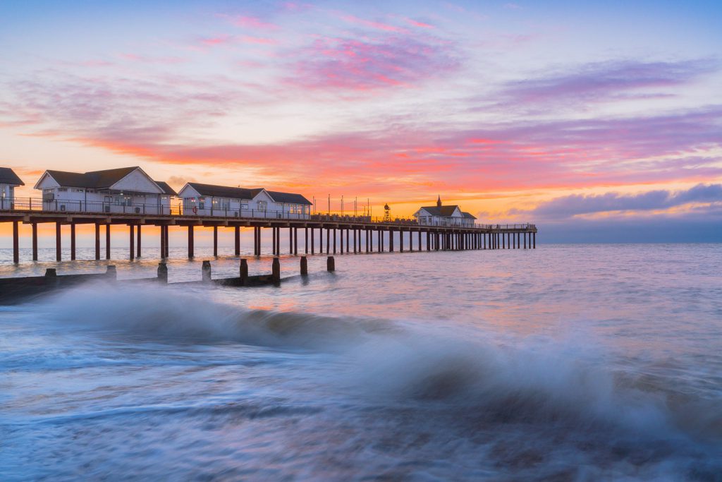 Southwold Pier at sunrise with colourful sky, Suffolk, England
