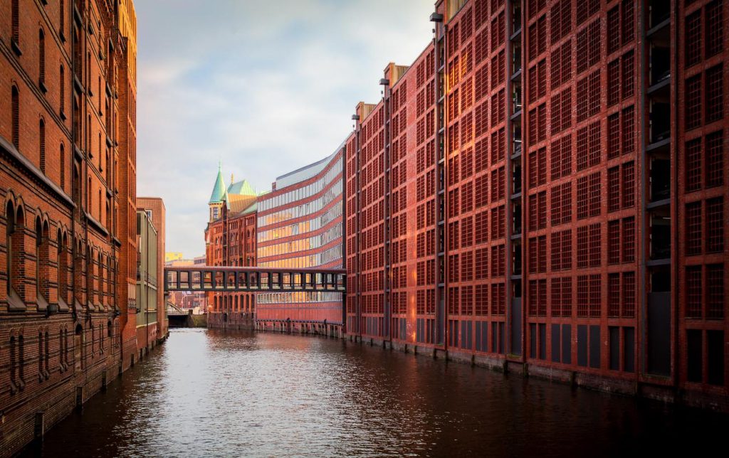 historic area of Speicherstadt in Hamburg with afternoon sunny light reflecting off buildings