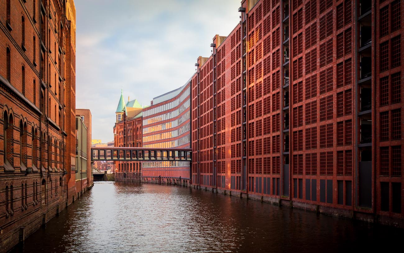 historic area of Speicherstadt in Hamburg with afternoon sunny light reflecting off buildings