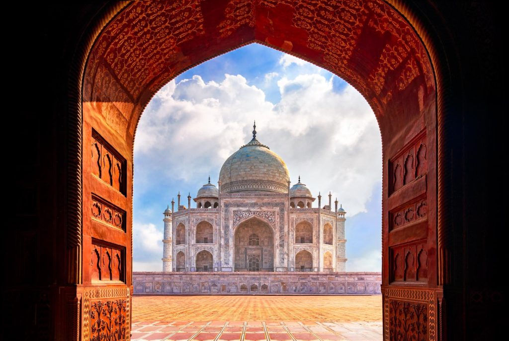 Taj Mahal framed by ornate archway in Agra, India
