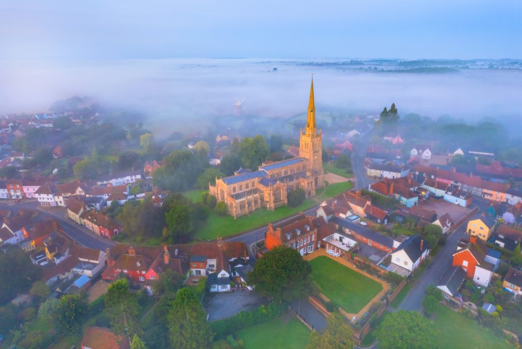 Mist envelops Thaxsted village and church in Essex, England