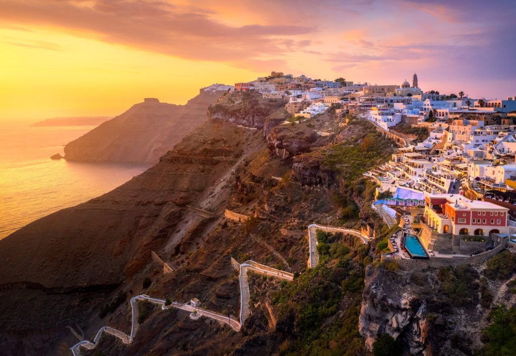 Aerial view of sunset over Santorini's cliffs, Greece