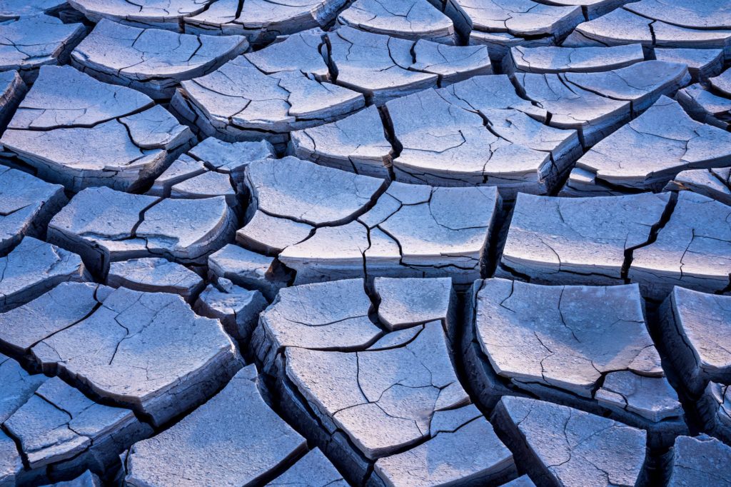 Mud cracks illuminated by twilight in Death Valley, USA
