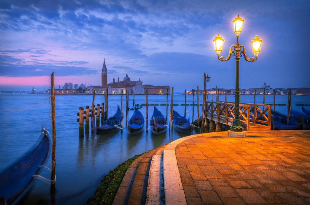 Classic view of Doge's Palace and gondolas in Venice, Italy