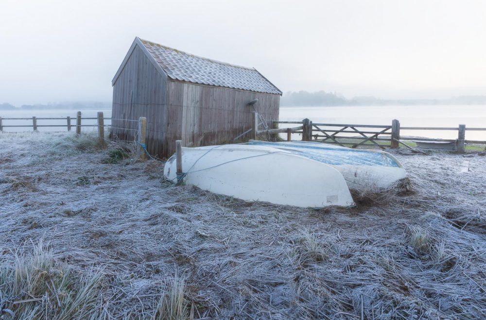 Boathouse on the River Deben in Woodbridge amid freezing fog