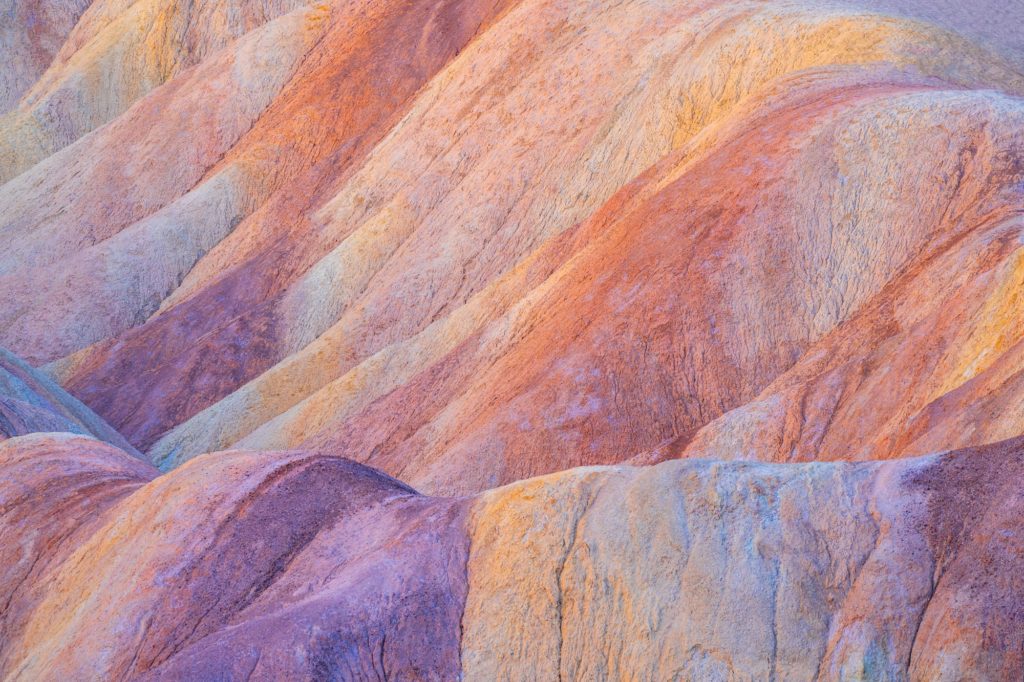 Vibrant, undulating colours of Zabriskie Point at sunrise, California, USA